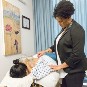 person performing acupuncture