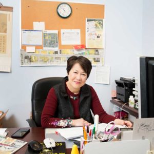 Chinese times owner at desk